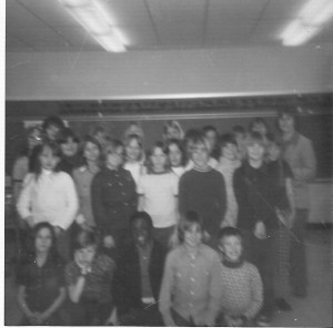 Fifth grade class; Kelly is standing in the first row, 2nd from the left in the dark shirt. 